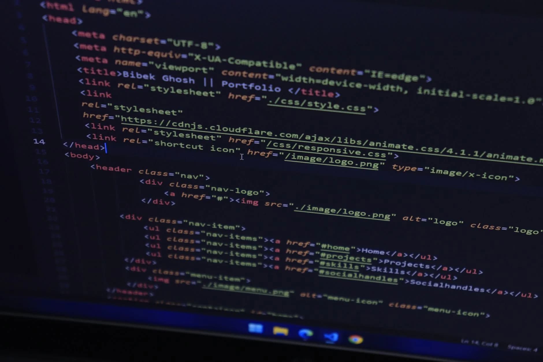 High-resolution close-up of HTML code displayed on a computer screen, perfect for technology themes.