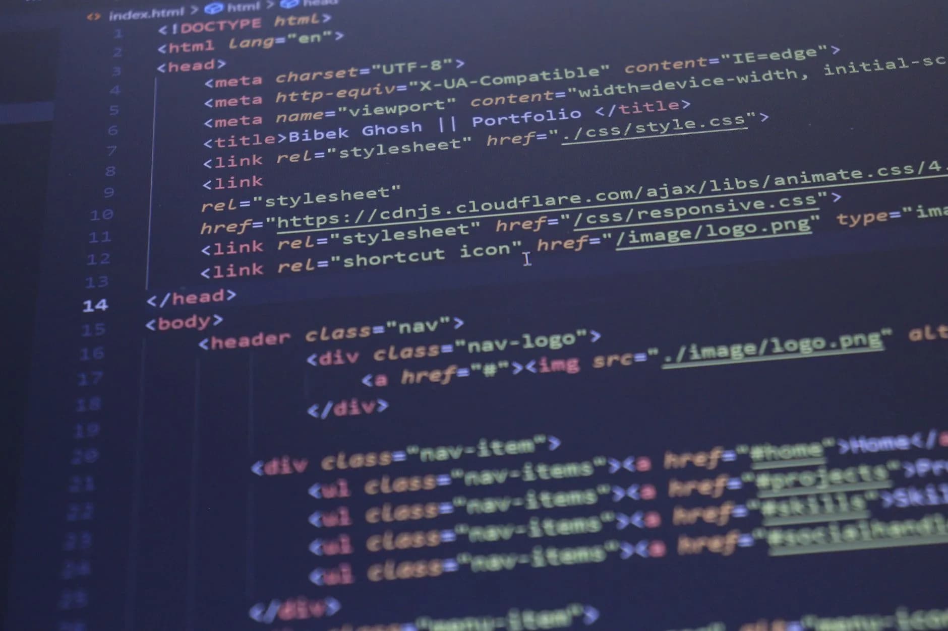 Close-up view of HTML and CSS code displayed on a computer screen, ideal for programming and technology themes.